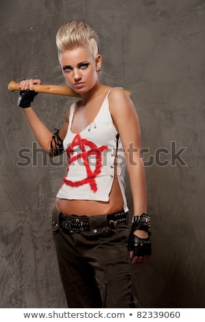 Foto d'archivio: Punk Girl With A Bat Isolated On White