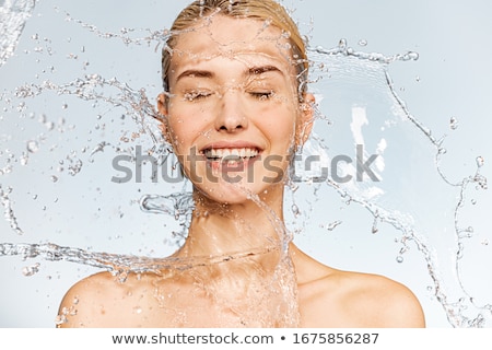 ストックフォト: Woman Showering With Happy Smile And Water Splashing