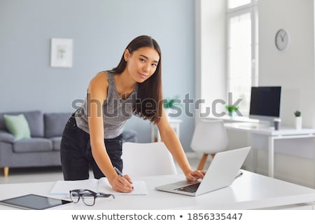 Stok fotoğraf: Business Woman Taking Notes Planning Her Day