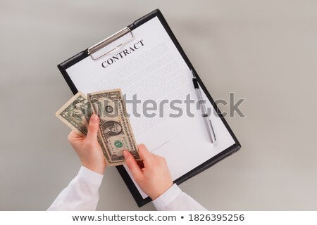 Foto stock: Dollar Sign With Clipboard And Pen