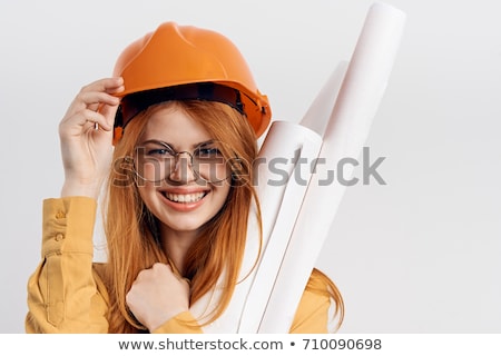 ストックフォト: Young Woman In Helmet With The Work Tools On A White