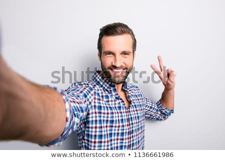 Foto stock: Close Up Portrait Of Bearded Man In Shirt Making Selfie