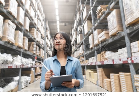 Stok fotoğraf: Woman Is Working At Warehouse For Online Store