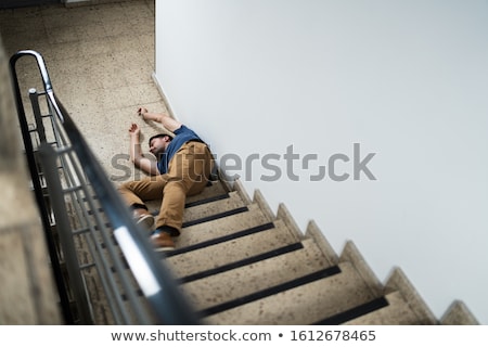 ストックフォト: Unconscious Man Lying On Staircase