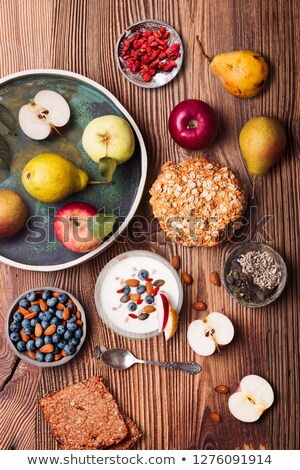 Stok fotoğraf: Breakfast On Table Yogurt With Added Bluberries And Roasted Alm