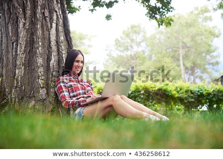 Stok fotoğraf: Woman On Laptop Under Tree