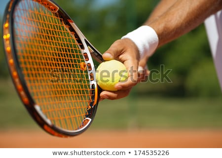 ストックフォト: Tennis Player With Racket Ready To Hit A Ball
