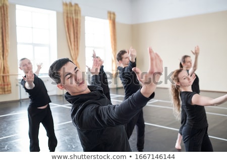 Foto stock: Group Of People Exercising In Dance Studio