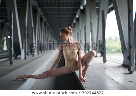 Foto stock: Graceful Ballerina In The Industrial Background