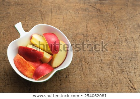 Apple Slicer On Vintage Cutting Board Stock foto © stickasa