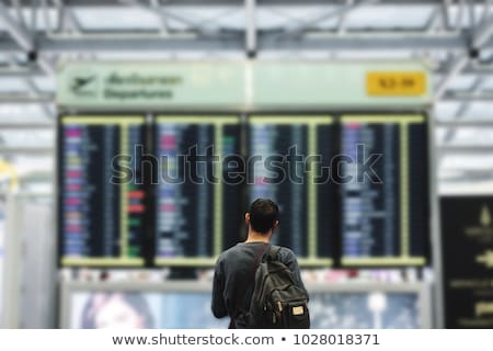 Zdjęcia stock: Man Looking At Departure Board