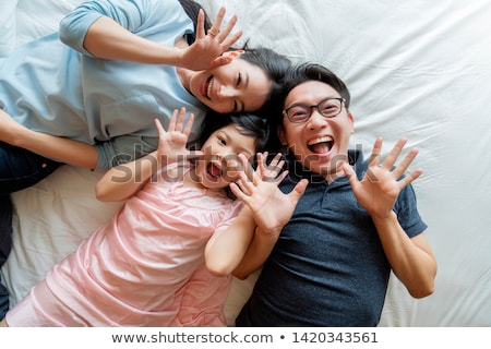 Stock foto: Conceptual Portrait Of A Mother Relaxing With Daughter On A Fres