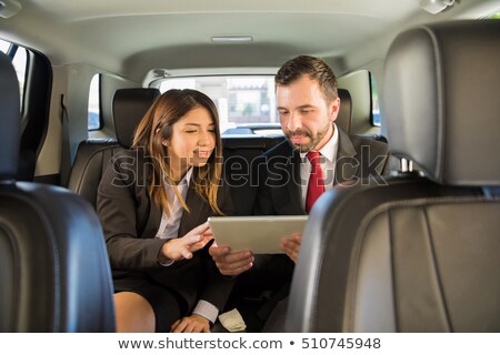 Сток-фото: Two Businesspeople Traveling By Car