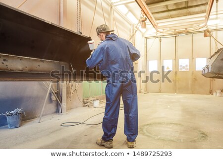 Stok fotoğraf: Varnisher In Industrial Metal Factory