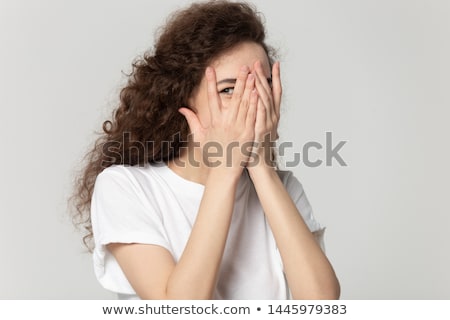 Stockfoto: Playful Young Girl Hides Her Face In Hair