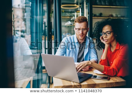 Foto d'archivio: Two Young Women With Netbook