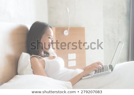 Stock photo: Laying Down With Laptop