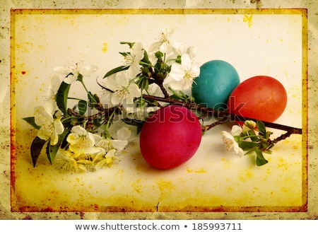 Foto stock: Grunge Old Carved Postcard With Eggs To Celebrate Easter On The