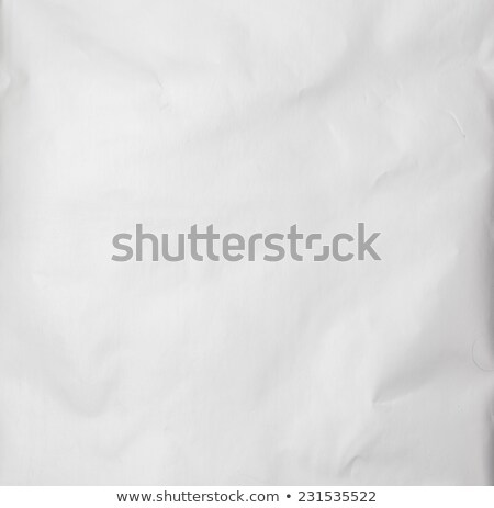 Сток-фото: Sheet Of Square Paper On Pile Of Aged Papers