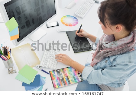 Stok fotoğraf: Graphic Designer Drawing Something On Graphic Tablet At The Home