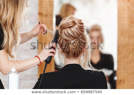 Foto stock: Hairdresser Waits For Customers