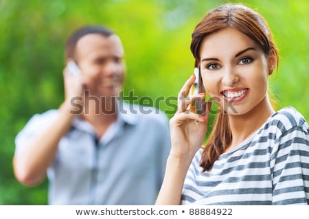 Stock fotó: Closeup Portrait Of A Calm Woman Talking On The Phone