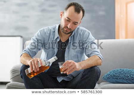 Foto d'archivio: Male Alcoholic Drinking Alcohol At Home