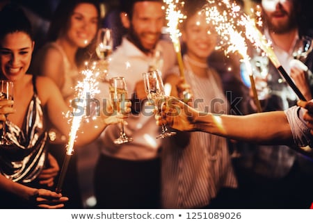 Stok fotoğraf: Happy Couple With Champagne Celebrating Christmas