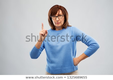 Stock fotó: Displeased Senior Woman In Glasses Warning