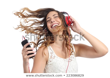 Zdjęcia stock: Teenage Girls Singing To Music On Mobile Phones