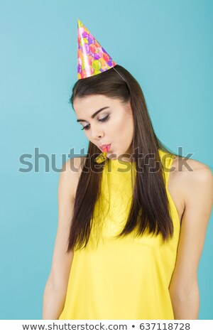 Foto stock: Happy Young Girl In Birthday Hat And Whistle