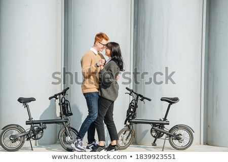 ストックフォト: Good Looking Couple Smiles And Dances Outside