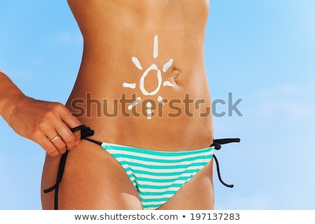 ストックフォト: Close Up Of Woman In Swimsuit Walking On Beach