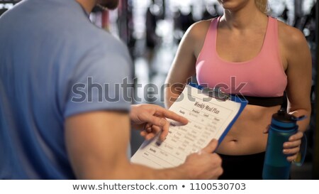 Foto d'archivio: A Fitness Trainer Helping A Client