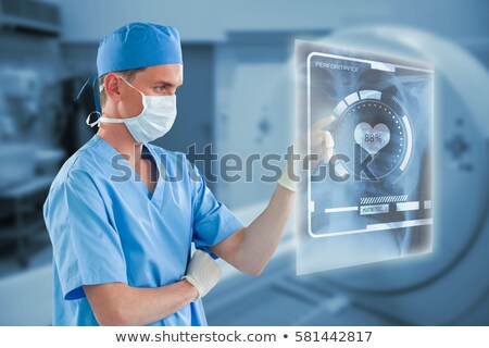 ストックフォト: Male Nurse Touching An Invisible Screen