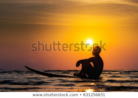 Сток-фото: Silhouette Of Surf Man Sitting With A Surfboard On The Seashore Beach At Sunset Time Banner Long Fo