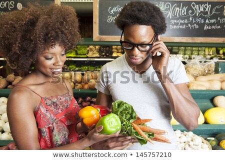 Foto stock: Young Woman Buying Shorts