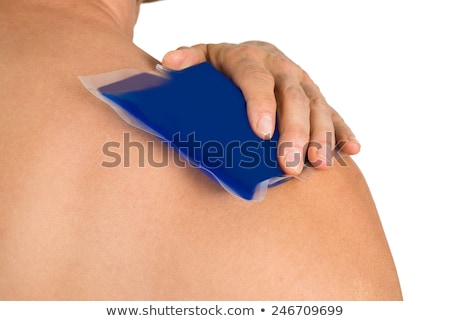 Stock foto: Blue Ice Pack On Back And Shoulders Of Shirtless Man