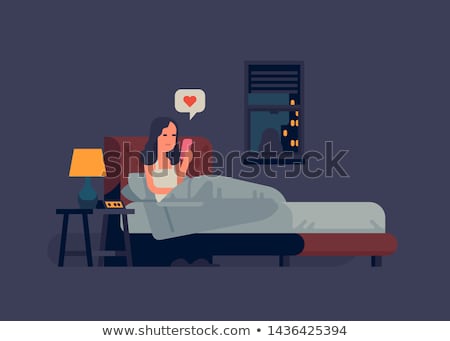 Сток-фото: Woman In Bed With Mobile Phone