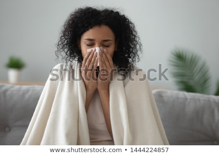 Foto d'archivio: Sick Woman In Blanket Coughing At Home