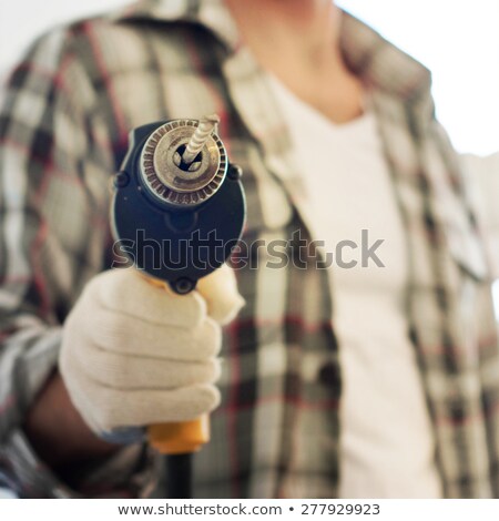 Stock foto: Craftsman Making A Hole In The Wall