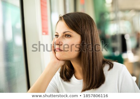 ストックフォト: Brunette Riding On Tram