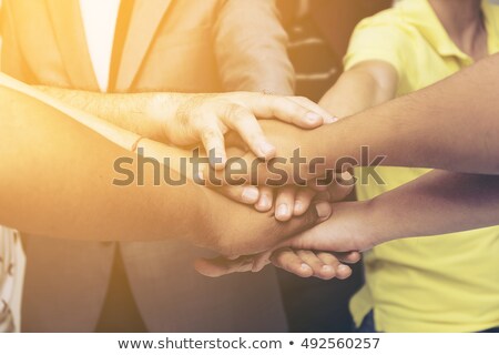 Stockfoto: Hands On Top Of Each Other Symbolic Picture