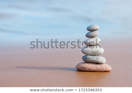 Stockfoto: Balancing Zen Stones Pyramid On Sand