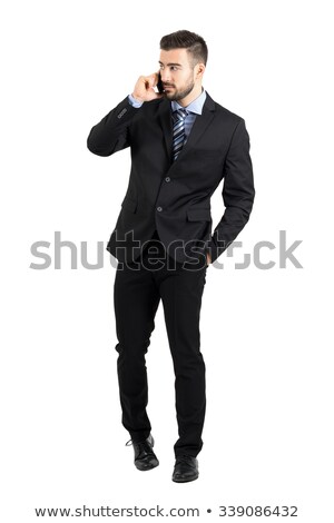 Foto d'archivio: Bearded Businessman With Phone Looking Seriously In Camera