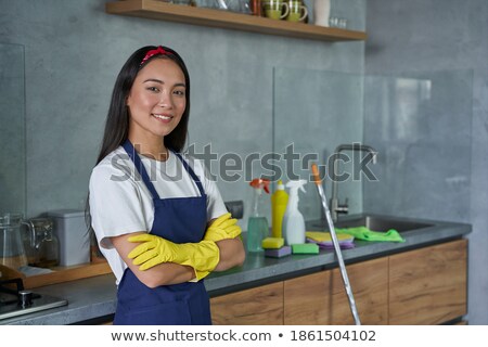 Stok fotoğraf: Portrait Of A Happy Pretty Housekeeper