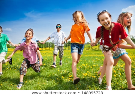 ストックフォト: Many Kids Playing In The Field