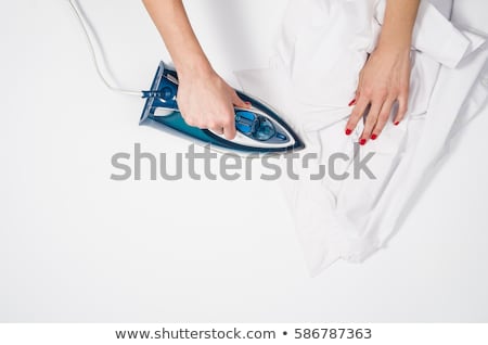 Stock fotó: Woman Ironing Clothes With Electric Iron