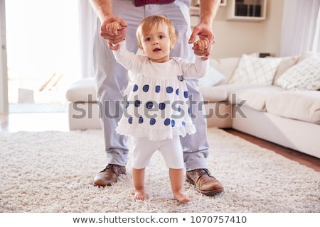 Zdjęcia stock: Baby Girl Standing With Father Help At Home