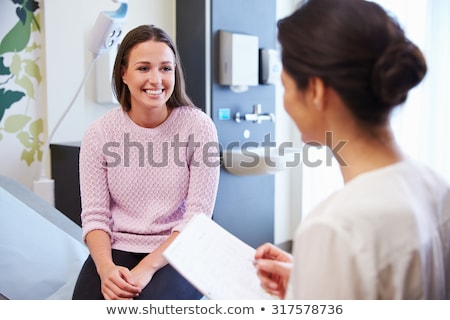 Stok fotoğraf: Doctor Having Consultation With Two Patients